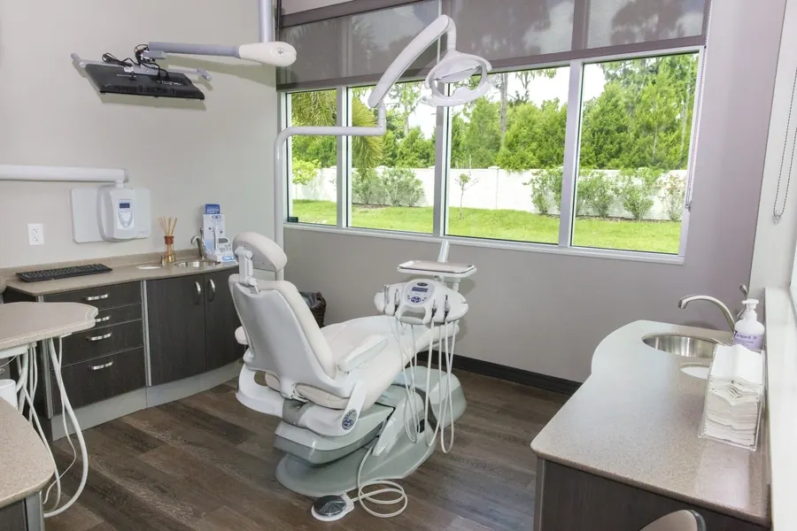 A treatment room with a large window at Tindal Prosthodontics.