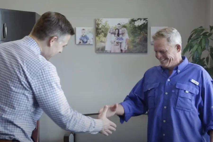 Dr. Ben Tindal greeting a patient at the practice.
